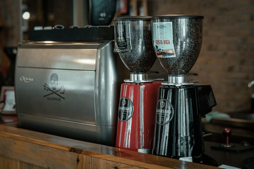 Commercial coffee grinders on a bar