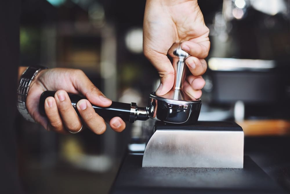 Barista holding a portafilter