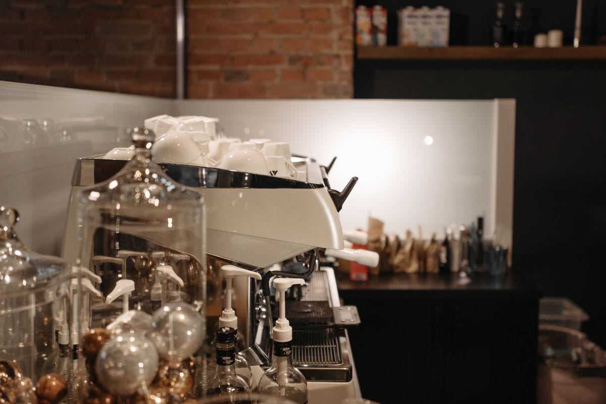 Commercial espresso machine being serviced