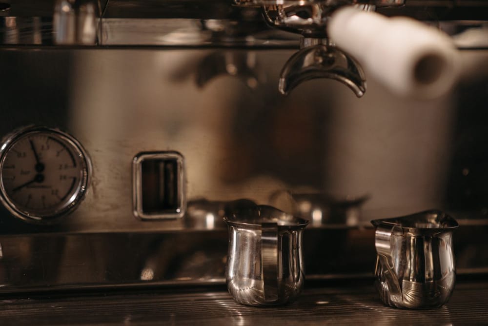 Espresso machine pressure gauge and portafilters